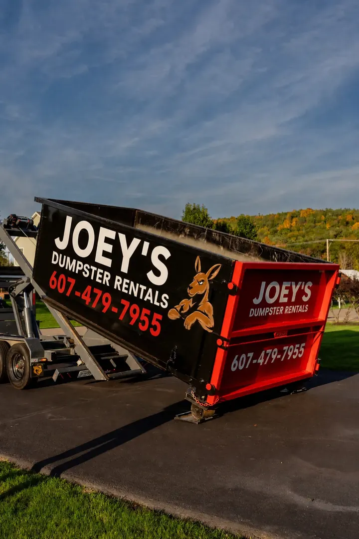A Joey’s Dumpster Rental roll-off dumpster ready for pickup